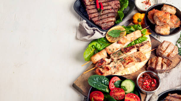 istock Meat dishes. Plates of various meat 1451297763