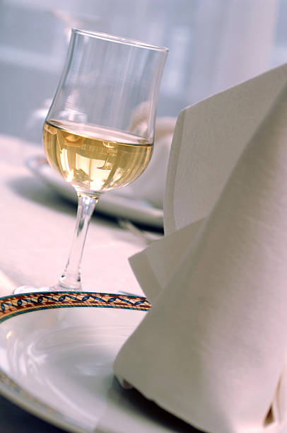 istock White wine in stem glass on table 145130407