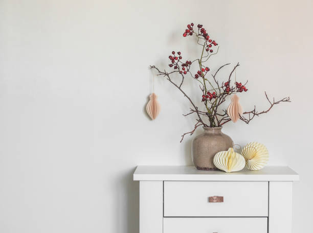 istock Christmas composition with branches and craft Christmas decorations on a wooden white table 1451305520