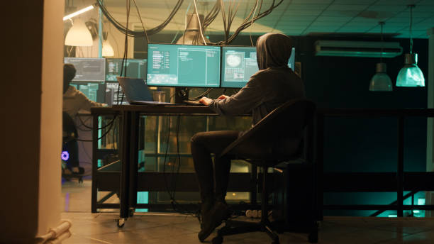 istock Male spy creating breach of security after gaining access to network system 1451305566