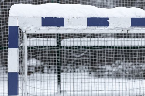 soccer goal covered with snow in winter. soccer goal top mast.