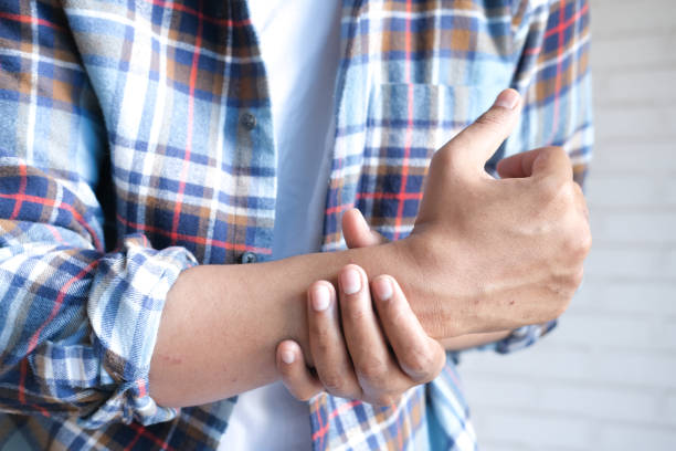 istock man suffering pain in hand close up 1451306235