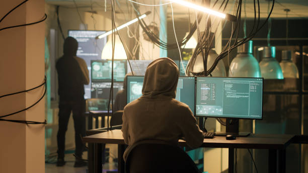istock Cyber criminals working with dark web to do illegal activities 1451306463