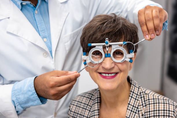istock Optometrist working with female patient at clinic 1451307374