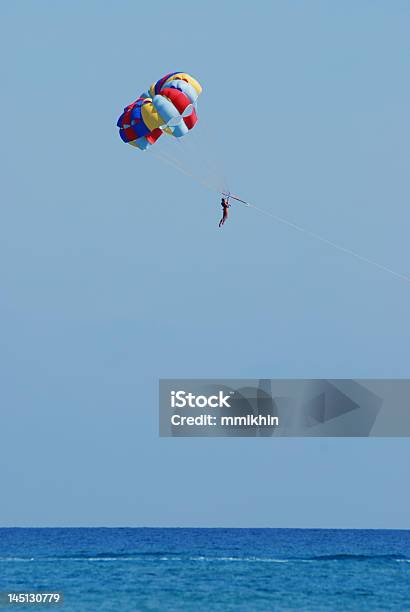 Parachuting Above The Sea Stock Photo - Download Image Now - Activity, Adventure, Beach