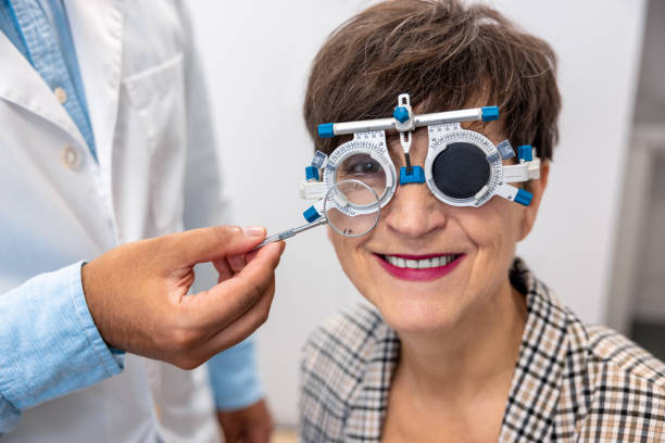 istock Optometrist working with female patient at clinic 1451307971