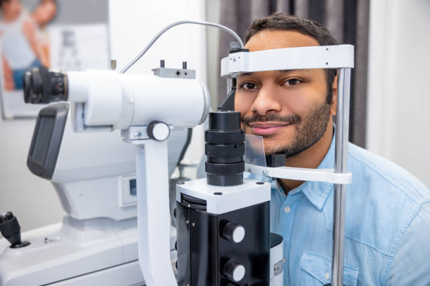 istock Young man having an examination in a ophtalmological clinic 1451308569