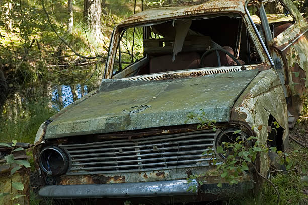 istock Abandoned car in a junkyard 145130936