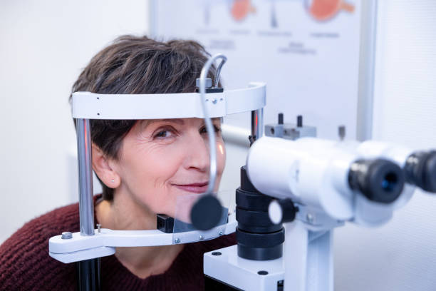 istock Mid aged woman having an optometric investigation 1451309814