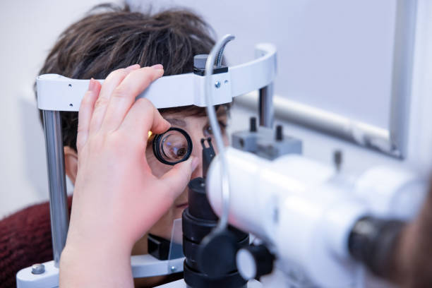 istock Mid aged woman having an optometric investigation 1451309855