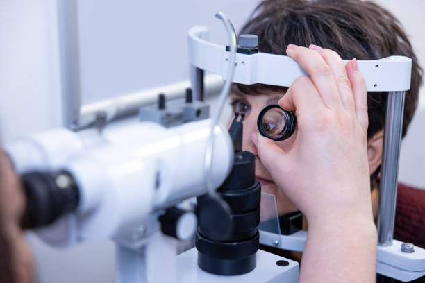 istock Mid aged woman having an optometric investigation 1451309859