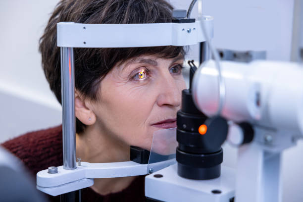 istock Mid aged woman having an optometric investigation 1451309892