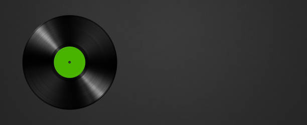 istock Green vinyl record isolated on black background. Horizontal banner 1451310399