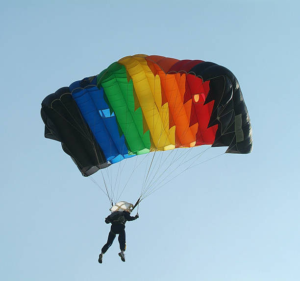 istock Parachutist with colourful parachute 145131180