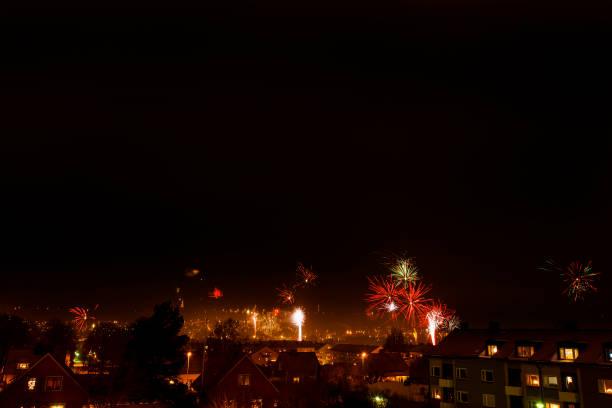 istock Fireworks on a dark sky over a city 1451312446