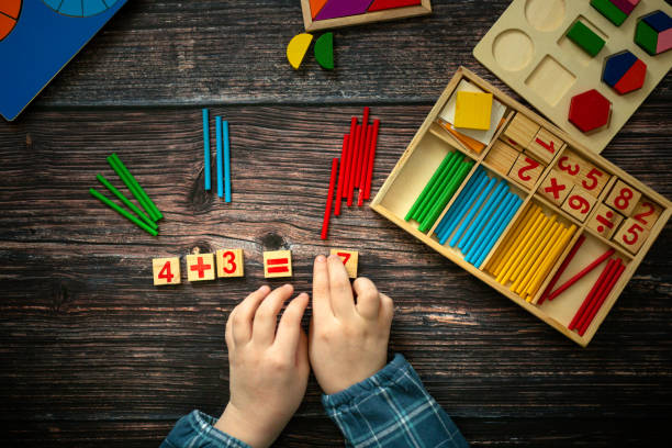 istock child decides an example. Wooden, top view 1451313257