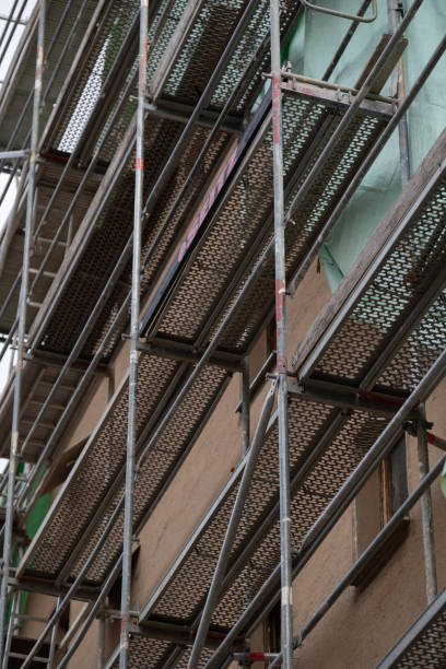 istock Scaffolding close-up texture. Preparatory building work. Home construction.Building materials and the process of repair a house. Construction and repair of the house. 1451314159