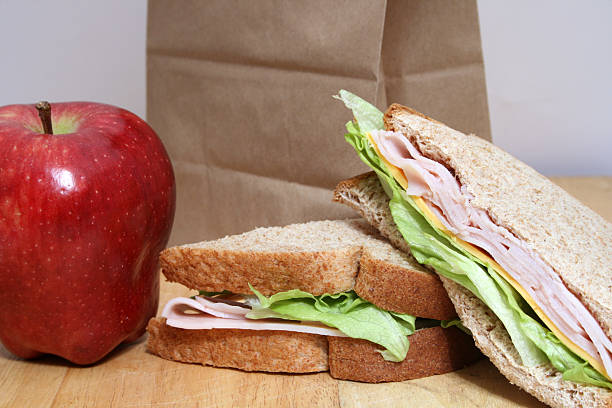 турция sandwhich - lunch bag apple brown стоковые фото и изображения
