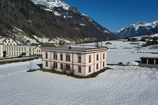 Diesbach with the former Textil Factory Legler. The Factory was in service from 1870 till 2001. The high angle image was captured during winter season and shows the former administratin building.