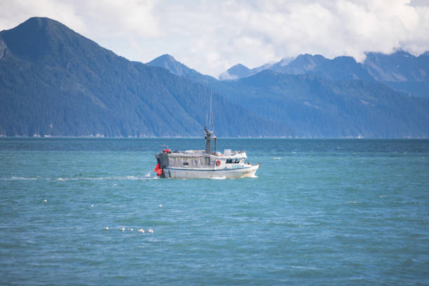 Alaskan fishing trawler making its way through icy water