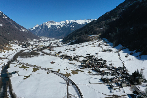 Glarus Süd with several villages and mountain peaks. The high angle image was captured during winter season.
