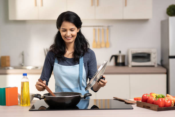 istock Woman in the kitchen stock photo 1451321949