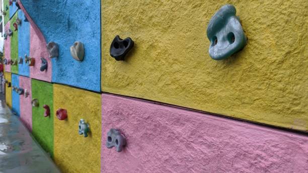 Artificial wall climbing track with various contrasting colors.