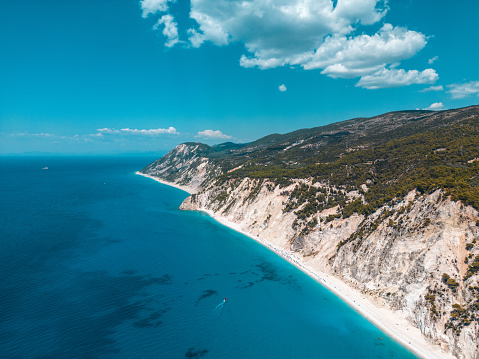 Drone shot of a beautiful coastline. Beautiful scenery and turquoise colored sea where land meets the sea at Porto Katsiki beach.