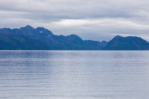Mountain range with cloudy sky in the Kenai Fjords National Park, Alaska
