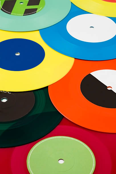A close-up of multicolored vinyl records stock photo