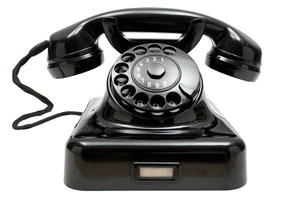 Old Phone Old-fashioned phone isolated on a white background. the past stock pictures, royalty-free photos & images