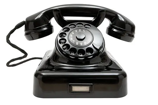 Old-fashioned phone isolated on a white background.