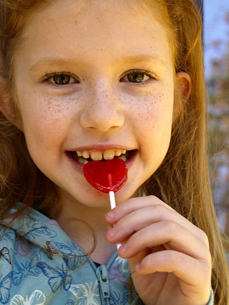 istock The Girl with A Lollipop 145132875