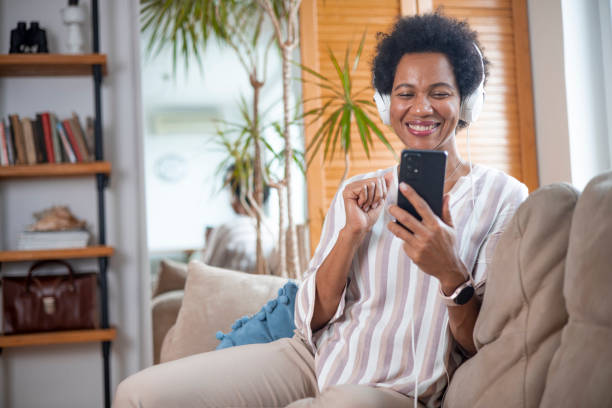 istock Happy black businesswoman using a smartphone 1451329994