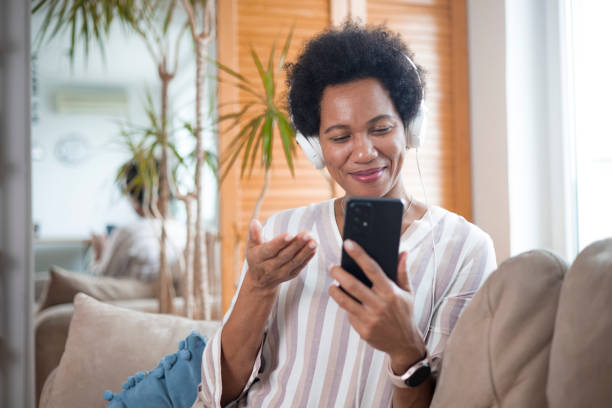istock Happy black businesswoman using a smartphone 1451330124