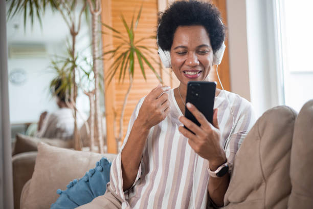 istock Happy black businesswoman using a smartphone 1451330125