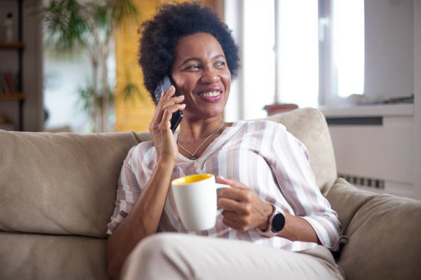 istock Happy black businesswoman using a smartphone 1451330429