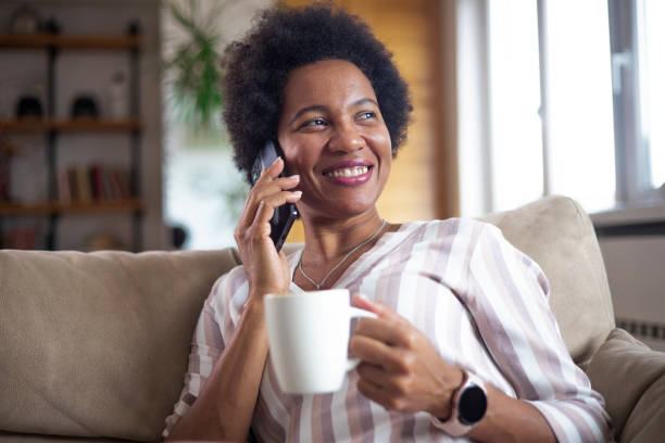 istock Happy black businesswoman using a smartphone 1451330470