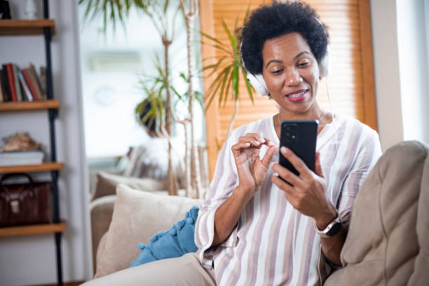 istock Happy black businesswoman using a smartphone 1451330790
