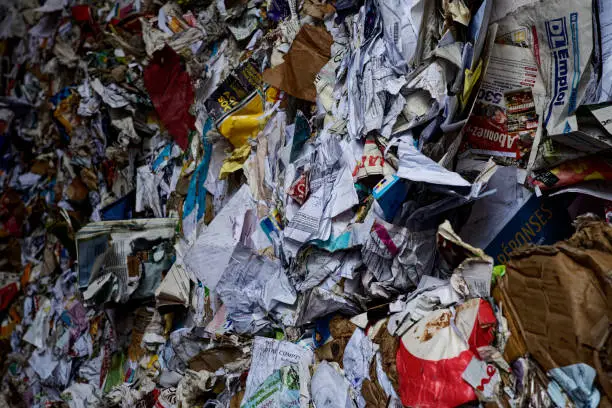 Close-up of a stack of compressed paper in a recycling center