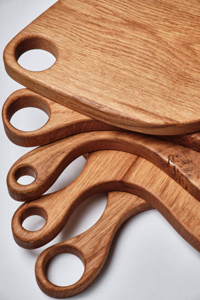 istock different kind of handmade oak chopping board on white background. 1451332996