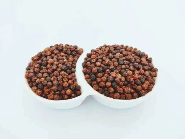 Black peppercorn blackpepper whole seeds grains  hot indian spice natural food ingredient cooking masala kali mirch closeup view image stock photo