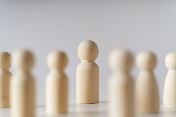 istock Wooden figures on white background. teamwork, leadership and business team creative thinking and human resources, Recruitment employee concept 1451336769