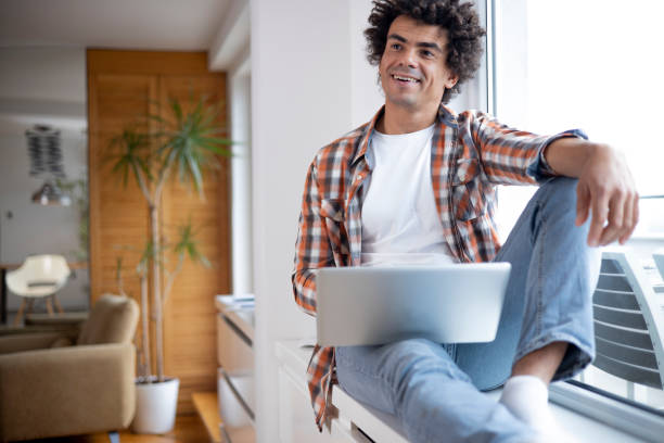 istock Young man working from home stock photo 1451336834