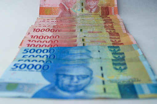 Indonesian Rupiah Money 100,000, 50,000 IDR banknotes. Isolated. Close-Up of Banknotes