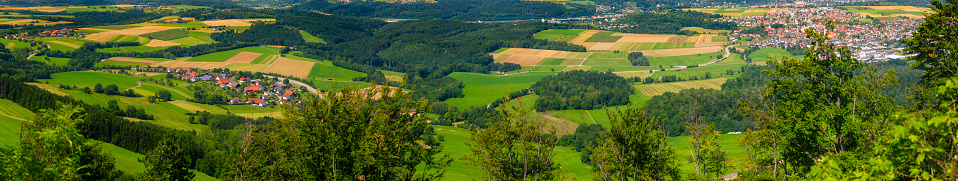 Panorama of the northern Swabian Alb with fields and villages and rocks in the foreground