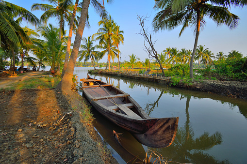 A narrow boat kept in a canal in Kerala backwaters.
