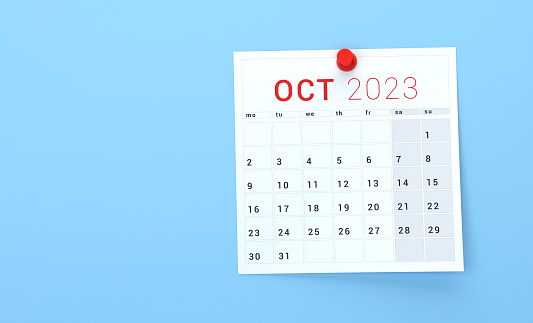 October 2023 Calendar Pinned On Blue Background.