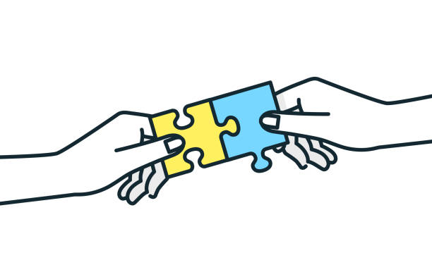 istock Pieces of the puzzle fit together. An image of working together to tackle and solve problems. 1451343115