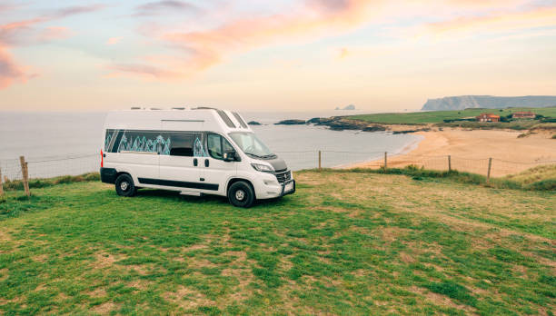 istock Camper van parked next to beach at summer 1451344880